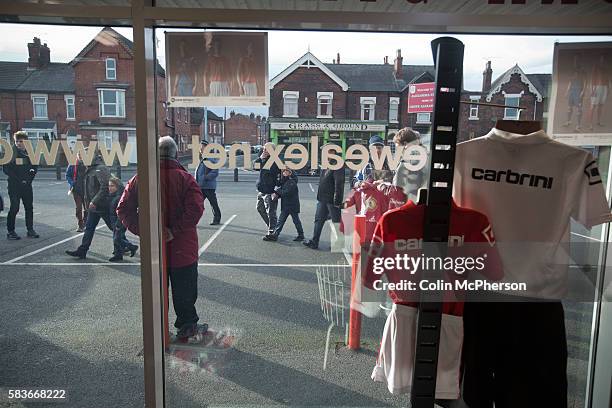 Supporters walking outside the club shop at the Alexandra Stadium on Gresty Road, Crewe, the home of Crewe Alexandra before their home game against...