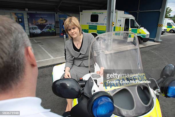Scotland's then deputy First Minister and health minister in the Scottish Executive, Nicola Sturgeon MSP, pictured talking to member of staff during...