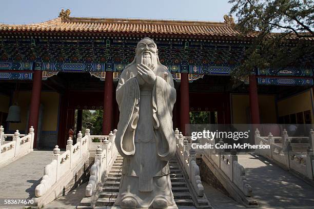 Statue of Confucius at the Confucius Temple and Guozijian in Beijing, China. The complex was first built during the Yuan Dynasty, and followed the...