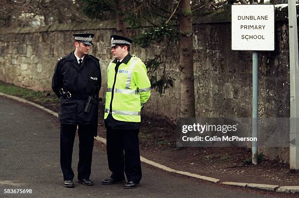 Two police officers on guard outside Dunblane primary school, Scotland, shortly after the shooting incident on the premises. The Dunblane school...