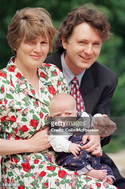 Helen Barker sits with her three-month-old son, Fergus, and surgeon Gordon MacKinlay, who performed a keyhole surgery for a bowel complaint on...