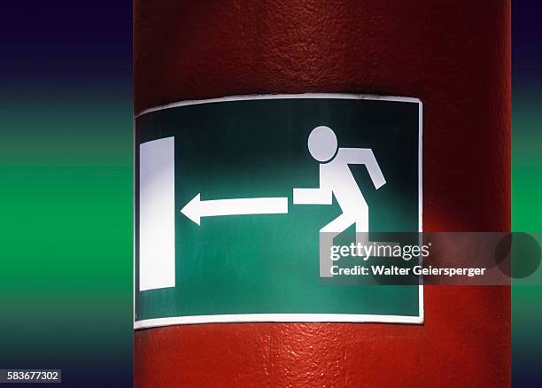 emergency exit sign in underground parking garage - 非常口 ストックフォトと画像