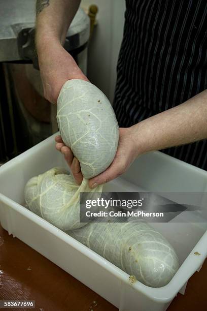 Champion haggis maker John Potter, who relocated from his native Scotland to Merseyside, filling sheep's stomachs with freshly-cooked haggis at...