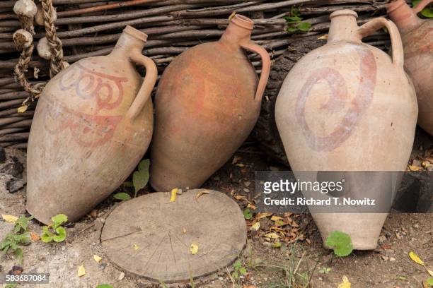 clay amphora are used to store wine - anfora fotografías e imágenes de stock