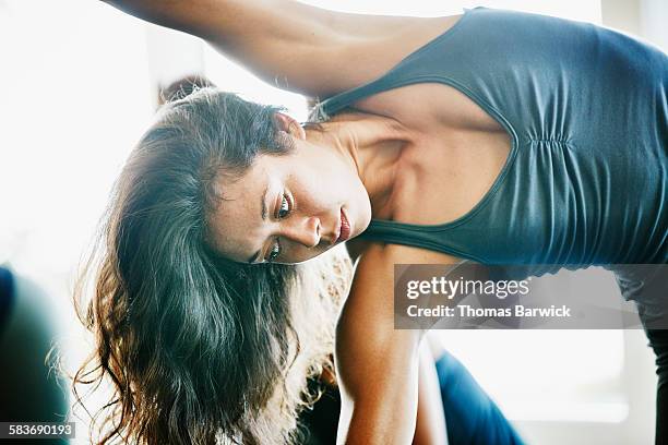 Woman practicing yoga in half side plank pose