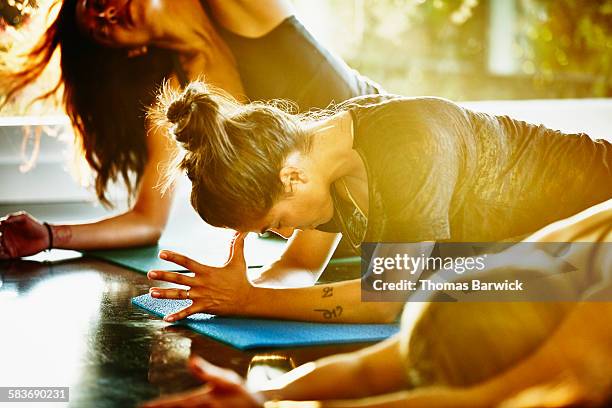 Woman resting between poses in yoga class