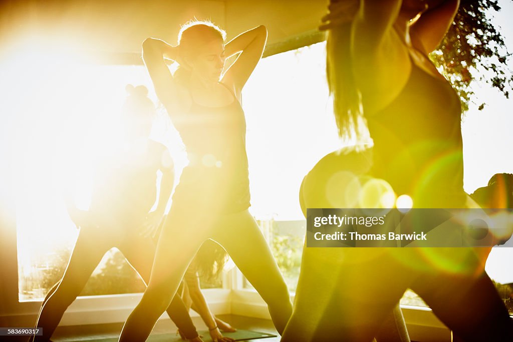 Women stretching and preparing for yoga class