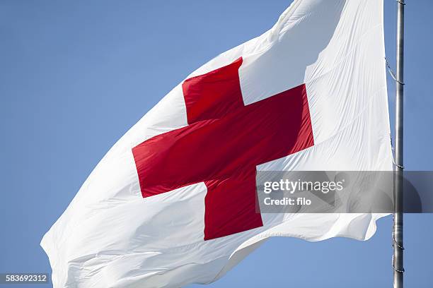 red cross flag - wisconsin flag stock pictures, royalty-free photos & images