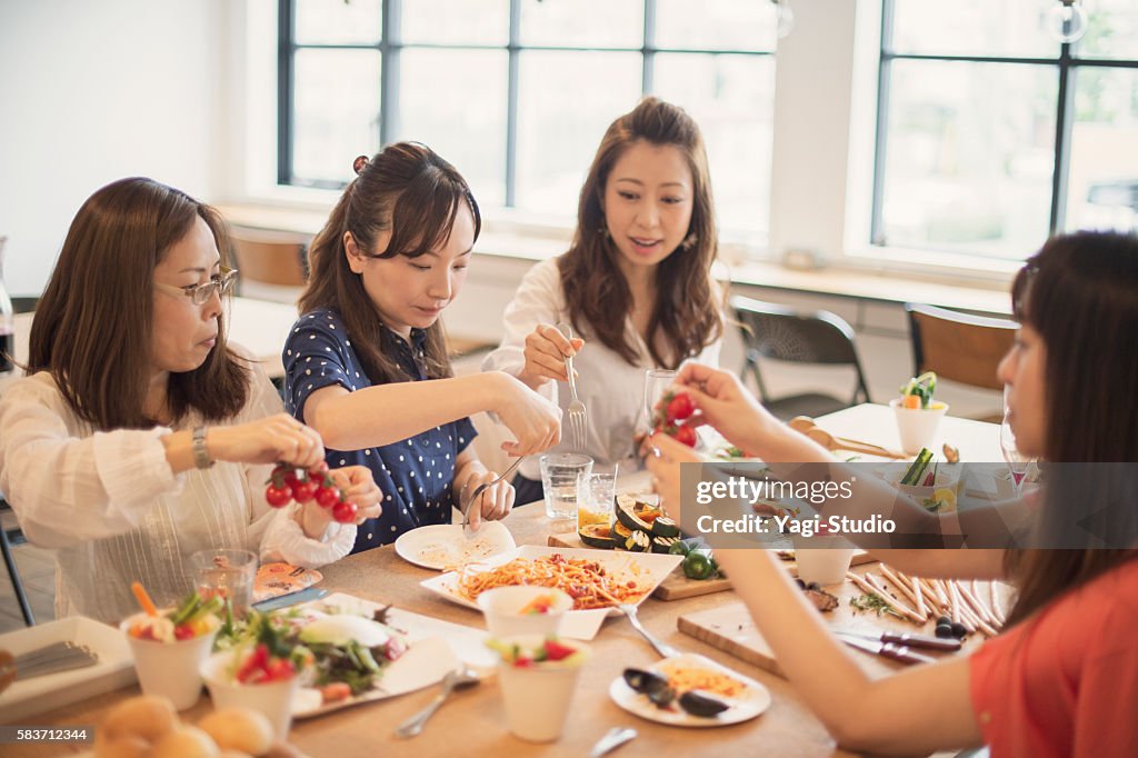 Girlfriends enjoying lunch party at a guesthouse