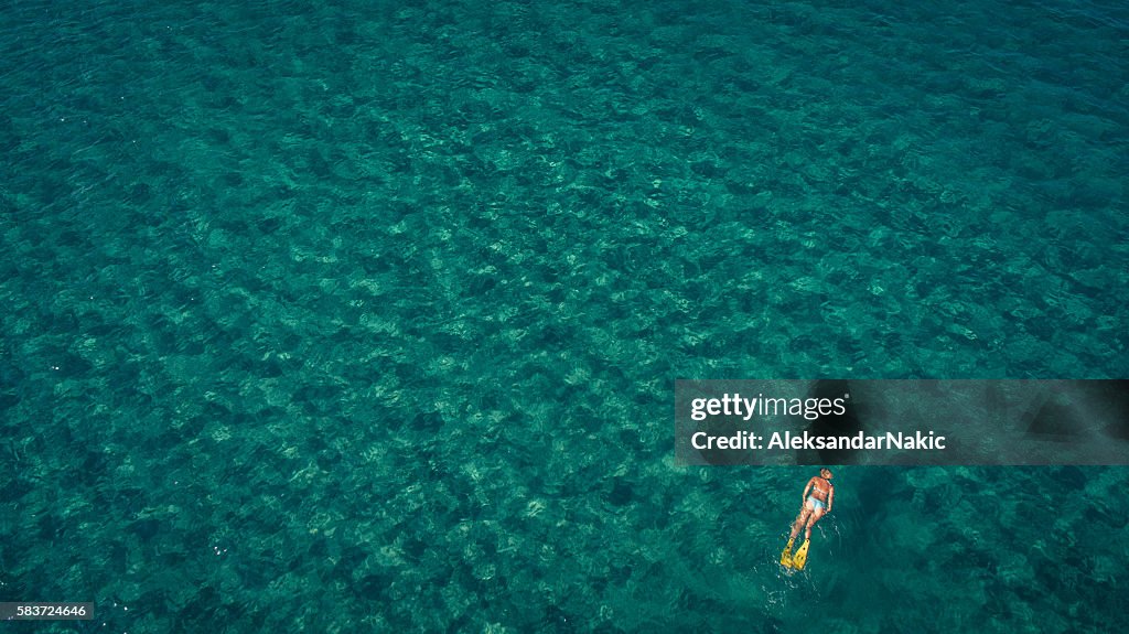 Scuba diving in turquise waters