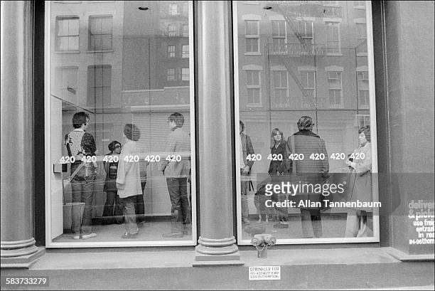 Art gallery patrons wait for an elevator at 420 West Broadway in SoHo, New York, New York, February 20, 1975.