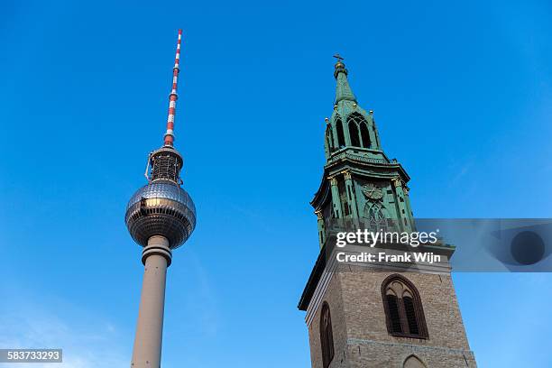 belin tv tower and st. mary's church - berlijn stock-fotos und bilder