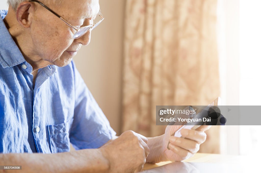 Senior Man Using a Smartphone