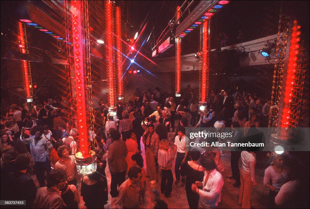 View of clubgoers amid the light towers on the dance floor at Studio ...