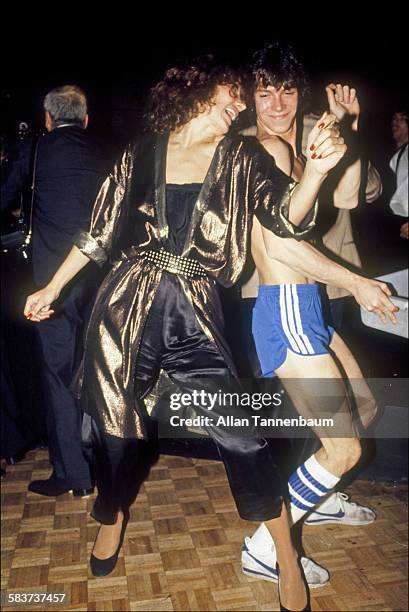 At Studio 54, Maggie Trudeau, wife of former Canadian Prime Minister Pierre Trudeau, dances with a busboy, New York, New York, 1980s.