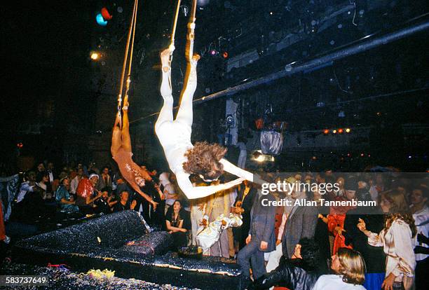 Acrobats descend from the rafters as part of a New Year's Eve party performance at Studio 54, New York, New York, January 1, 1978.