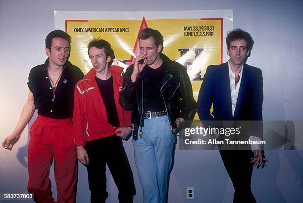 Portrait of British punk rock group the Clash, from left, Joe Strummer, Topper Headon, Paul Simenon, and Mick Jones, as they give a press conference...