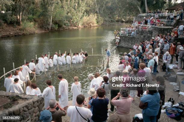 pilgrims baptised in jordan river - jordan bildbanksfoton och bilder