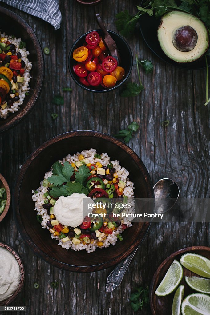 A bowl of Mexican Burrito Bowl with cashew cream sauce