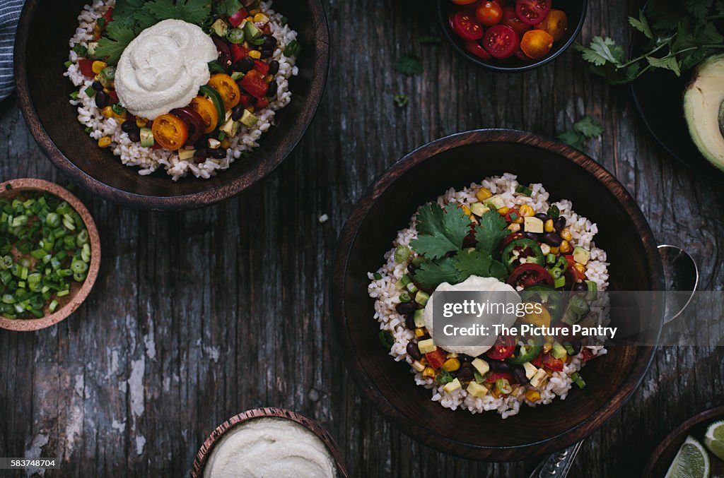 A bowl of Mexican Burrito Bowl with cashew cream sauce