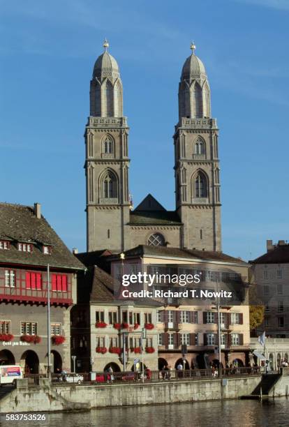 grossmunster cathedral along the river - grossmunster cathedral stock pictures, royalty-free photos & images