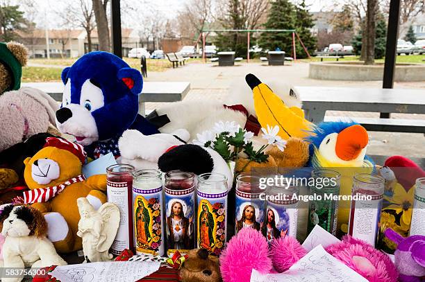 Mourners covered a park table at the Cudell Commons Park with stuffed animals, prayer candles, and letters for 12-year old Tamir Rice in Cleveland,...