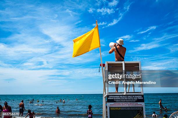 Lifeguard calls out to swimmers at Edgewater Beach on July 26, 2015 in Cleveland, Ohio. The Cleveland Metroparks have been maintaining the beach...