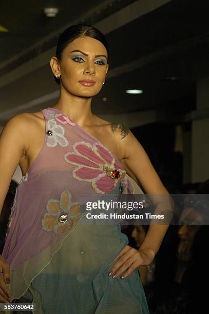 Model presenting the design by Nisha Jamvwal fashion show at Amara, Kemps corner.