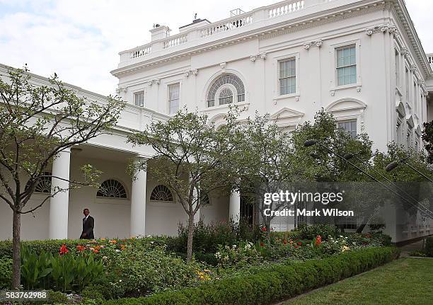 President Barack Obama walks across the colonnade toward the Oval office July 27, 2016 in Washington, DC. Later tonight President Obama will travel...