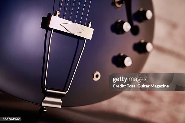 Detail of the trapeze tailpiece on a Epiphone Gary Clark Jr Blak And Blu Casino electric guitar, taken on September 23, 2015.