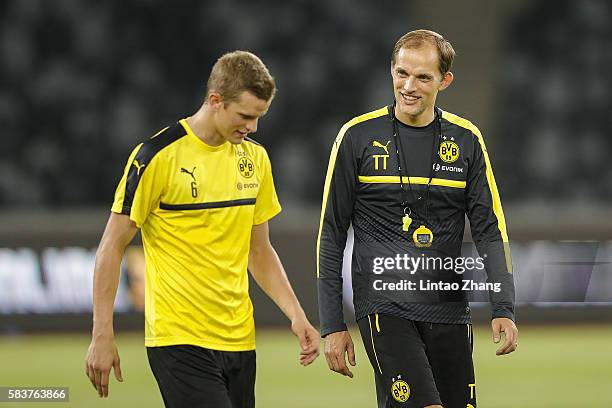 Thomas Tuchel, head coach of Dortmund talk with Sven Bender during team training session for 2016 International Champions Cup match between...