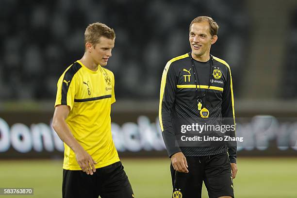 Thomas Tuchel, head coach of Dortmund talk with Sven Bender during team training session for 2016 International Champions Cup match between...