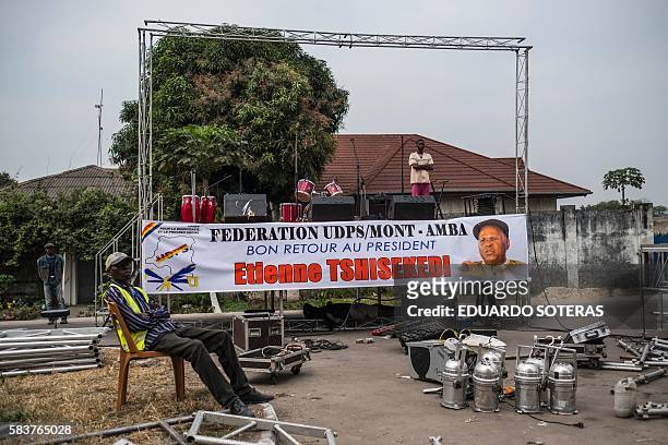 Supporters of Etienne Tsisekedi await at a stage in front of his residence in Kinshasa on July 27, 2016 as Congo's veteran opposition chief comes...