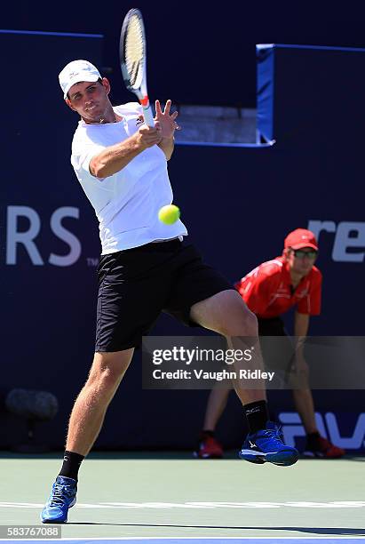 Dennis Novikov plays a shot against Kei Nishikori of Japan on Day 3 of the Rogers Cup at the Aviva Centre on July 27, 2016 in Toronto, Ontario,...