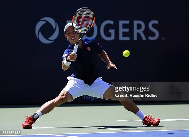 Kei Nishikori of Japan plays a shot against Dennis Novikov on Day 3 of the Rogers Cup at the Aviva Centre on July 27, 2016 in Toronto, Ontario,...