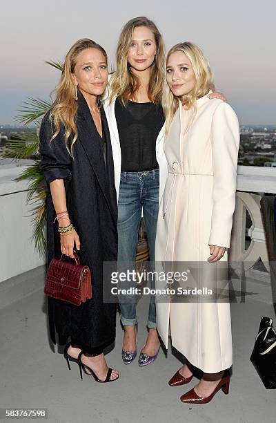 Designer Mary-Kate Olsen, actress Elizabeth Olsen and designer Ashley Olsen attend Elizabeth and James Flagship Store Opening Celebration with...