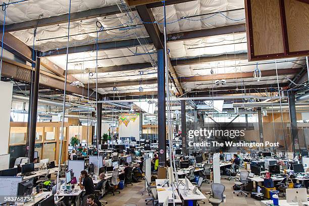 Employees can be seen inside Facebook's which may be the longest continuous work space in the world.