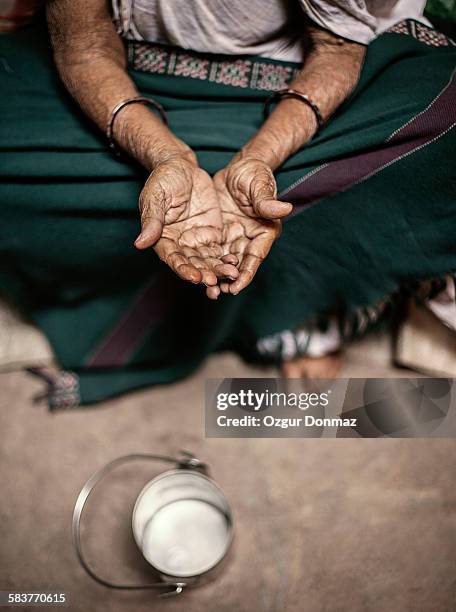 old woman begging on the street, varansi, india - beggar stock-fotos und bilder