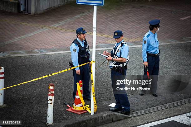 Police officers continue to investigate on knife attack in a handicap center in Tsukui Yamayuri-en building at Sagamihara on Wednesday, July 27, 2016...