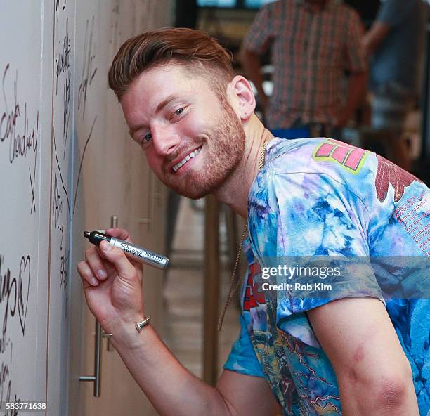 Marc E. Bassy signs the wall at AOL Build at AOL HQ on July 27, 2016 in New York City.