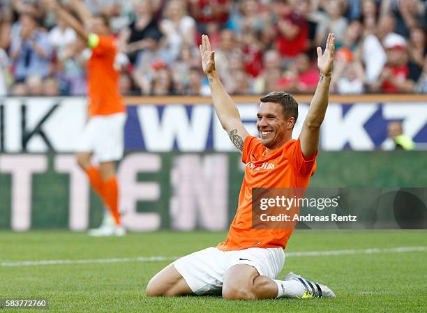 Lukas Podolski celebrates during the 'Champions for charity' football match between Nowitzki All Stars and Nazionale Piloti in honor of Michael...