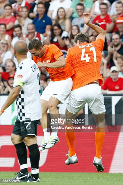Lukas Podolski and Dirk Nowitzki celebrate during the 'Champions for charity' football match between Nowitzki All Stars and Nazionale Piloti in honor...