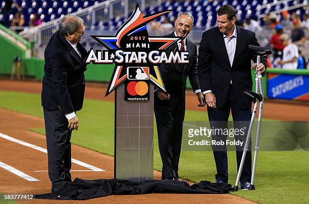Miami Marlins owner Jeffrey Loria, Major League Baseball commissioner Rob Manfred and former Marlin Jeff Conine looks on for the unveiling of the...