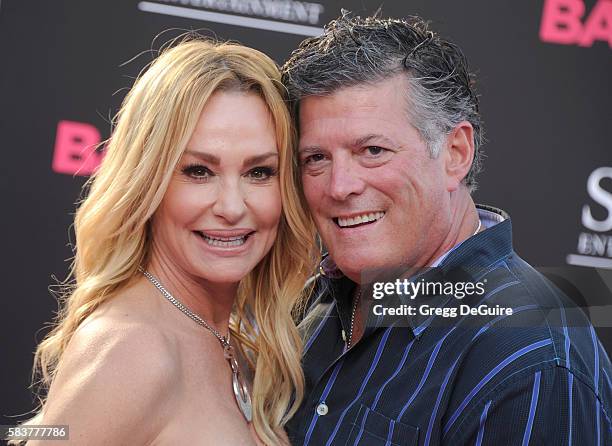 Personality Taylor Armstrong and husband John Bluher arrive at the premiere of STX Entertainment's "Bad Moms" at Mann Village Theatre on July 26,...