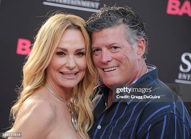 Personality Taylor Armstrong and husband John Bluher arrive at the premiere of STX Entertainment's "Bad Moms" at Mann Village Theatre on July 26,...