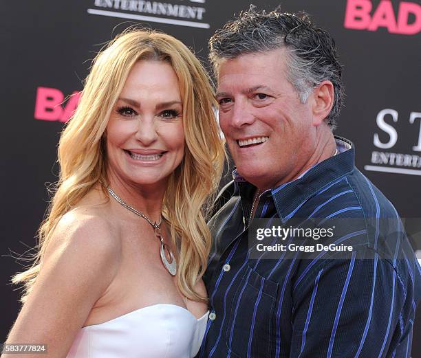 Personality Taylor Armstrong and husband John Bluher arrive at the premiere of STX Entertainment's "Bad Moms" at Mann Village Theatre on July 26,...