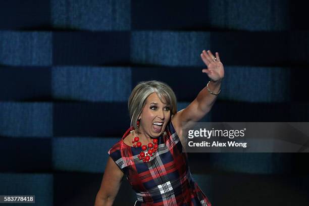 Representative Michelle Lujan Grisham waves to the crowd as she walks on stage to deliver remarks on the third day of the Democratic National...