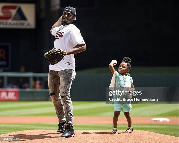 Laquon Treadwell of the Minnesota Vikings throws out the first pitch prior to the game between the Minnesota Twins and New York Yankees on June 18,...