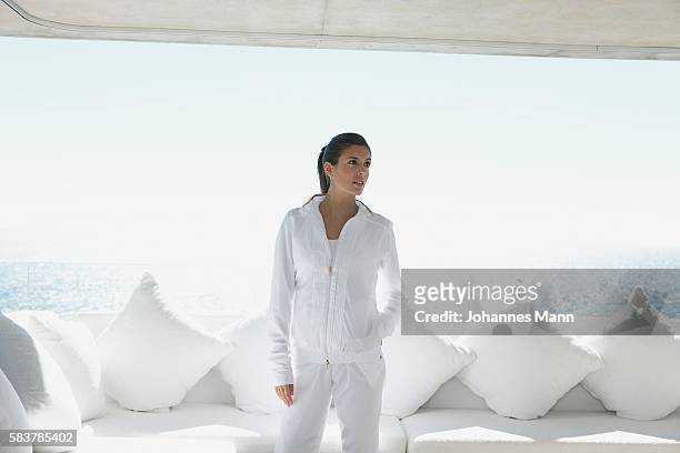 woman standing on deck - woman jogging pants stock pictures, royalty-free photos & images