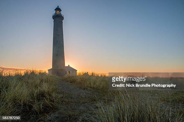 denmark, skagen, lighthouse at the beach - kattegat stock-fotos und bilder